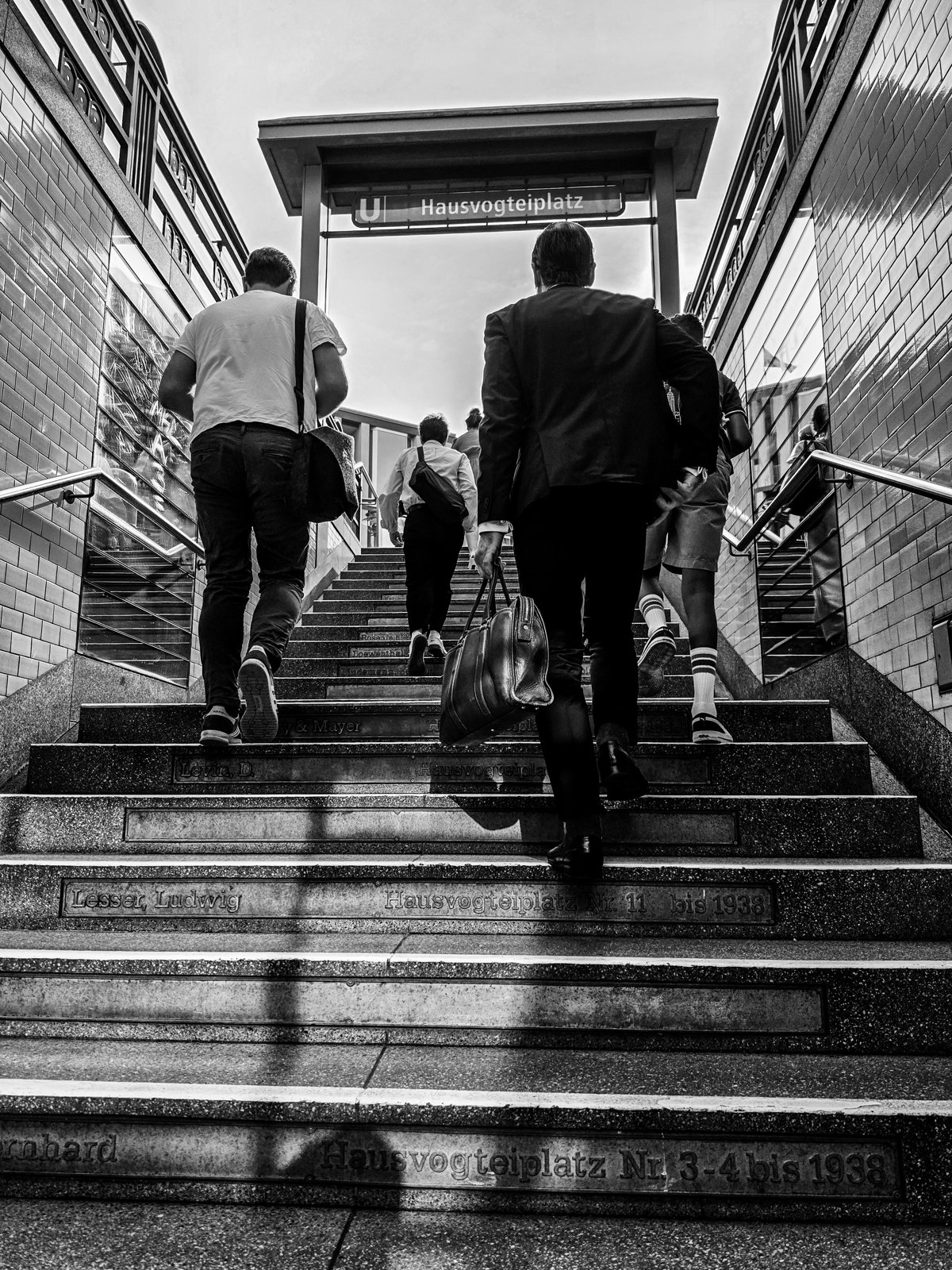 Black and white street photograph by Marius