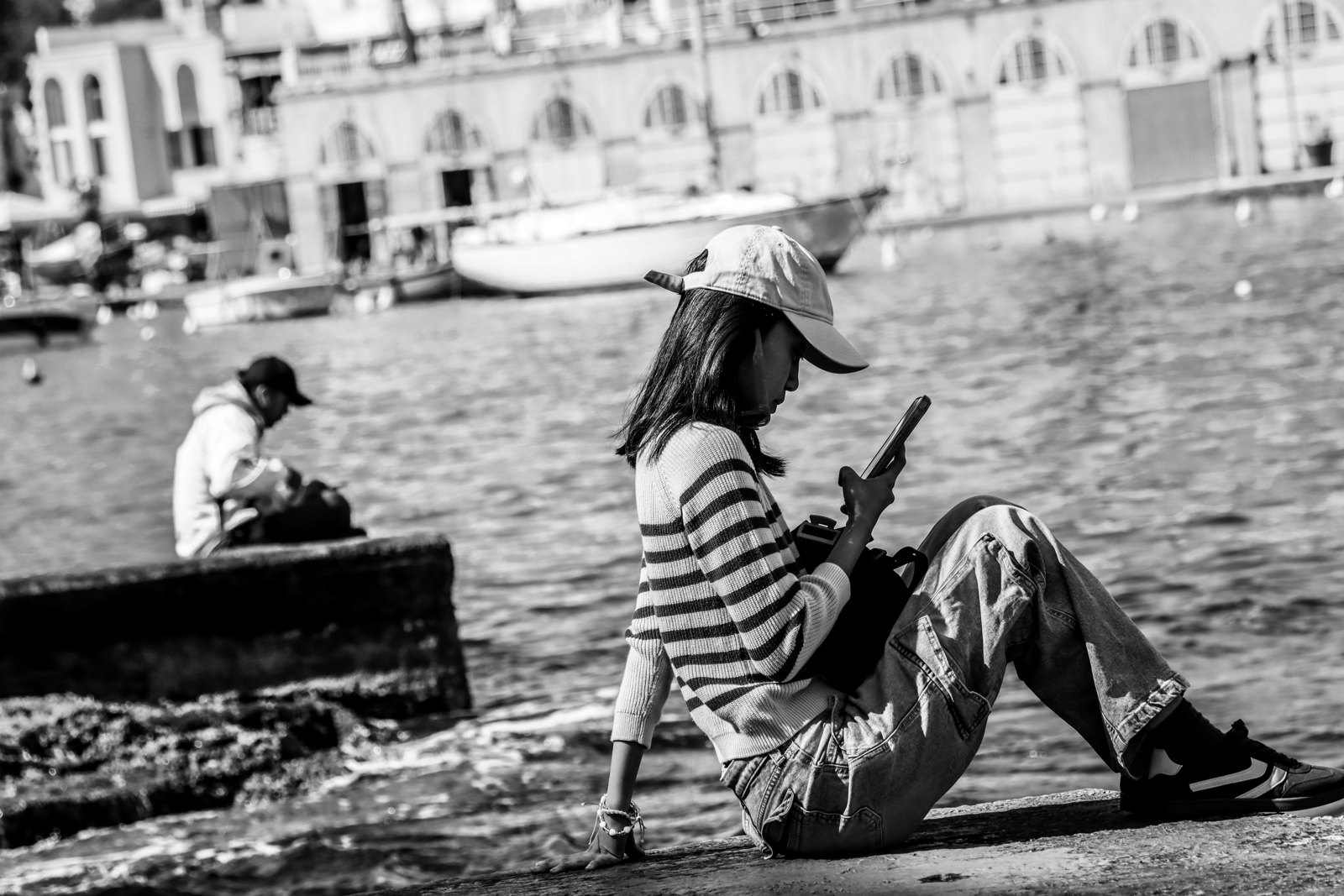 Black and white street photograph by Marius